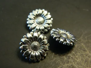 Metal buttons symbolizing spiritual abuse and misused authority through legalism